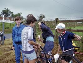 Robert Ellis continues repairs to Antony's puncture while Antony hides his face in shame: "It wasn't my fault, honest!".  Watched by John Stuart, Colin Brierly and Carl Jeffereys