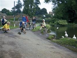 East Quantoxhead.  Jean and Frank enjoy the ducks while Liz ponders.