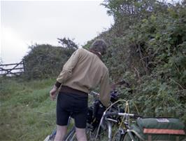 Michael retrieving something from his saddlebag