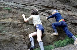 Mark Morton attempts to climb Blackingstone Rock - do you recognise the other youngster?