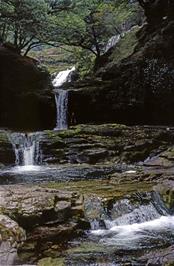 The second waterfall - Sgwd Isaf Clun-gwyn, or Lower Fall of the White Meadow - with Matthew trying to stay dry