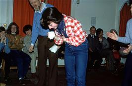 Frances takes her turn with the cup