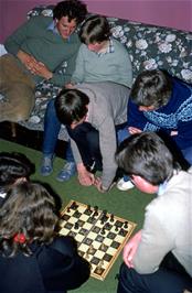 Board games in the common room at Elmscott hostel