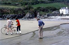 John Stuart, Stephen Downer and Mark Sheppard on Lannacombe Beach, with our sheltered lunch spot on the rocks