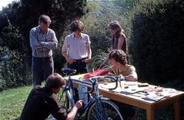 Michael Ward's Highwayman stand at Maypool youth hostel's May Fair, with Kevin adjusting his bike and Don and Mark looking on