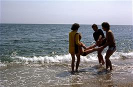 Mark, Kevin and Michael Ward prepare to give Matthew Tewson a thorough soaking at Blackpool Sands