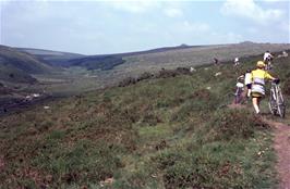 Pushing the bikes along the footpath from Two Bridges towards Wistman's Wood, with Crow Tor beyond