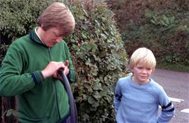 Phil and Matthew Burrows help with the puncture repair