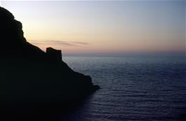 A wonderful sunset beyond Tintagel Castle, as viewed from the Lower Courtyard on the mainland by Andy and Michael on their evening walk