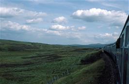 The train crosses bleak Rannoch Moor